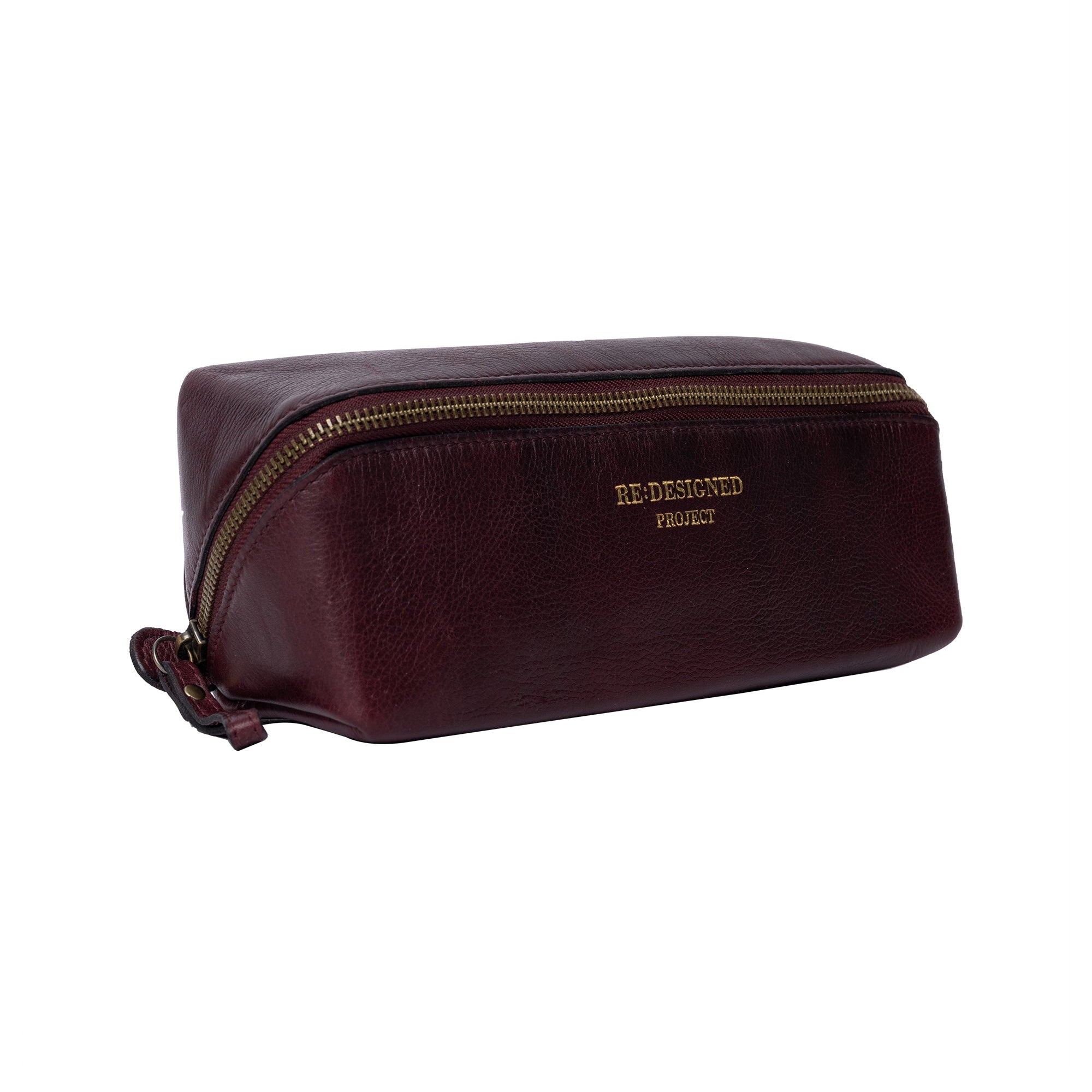 Brown leather toiletry bag with gold zipper on a white background