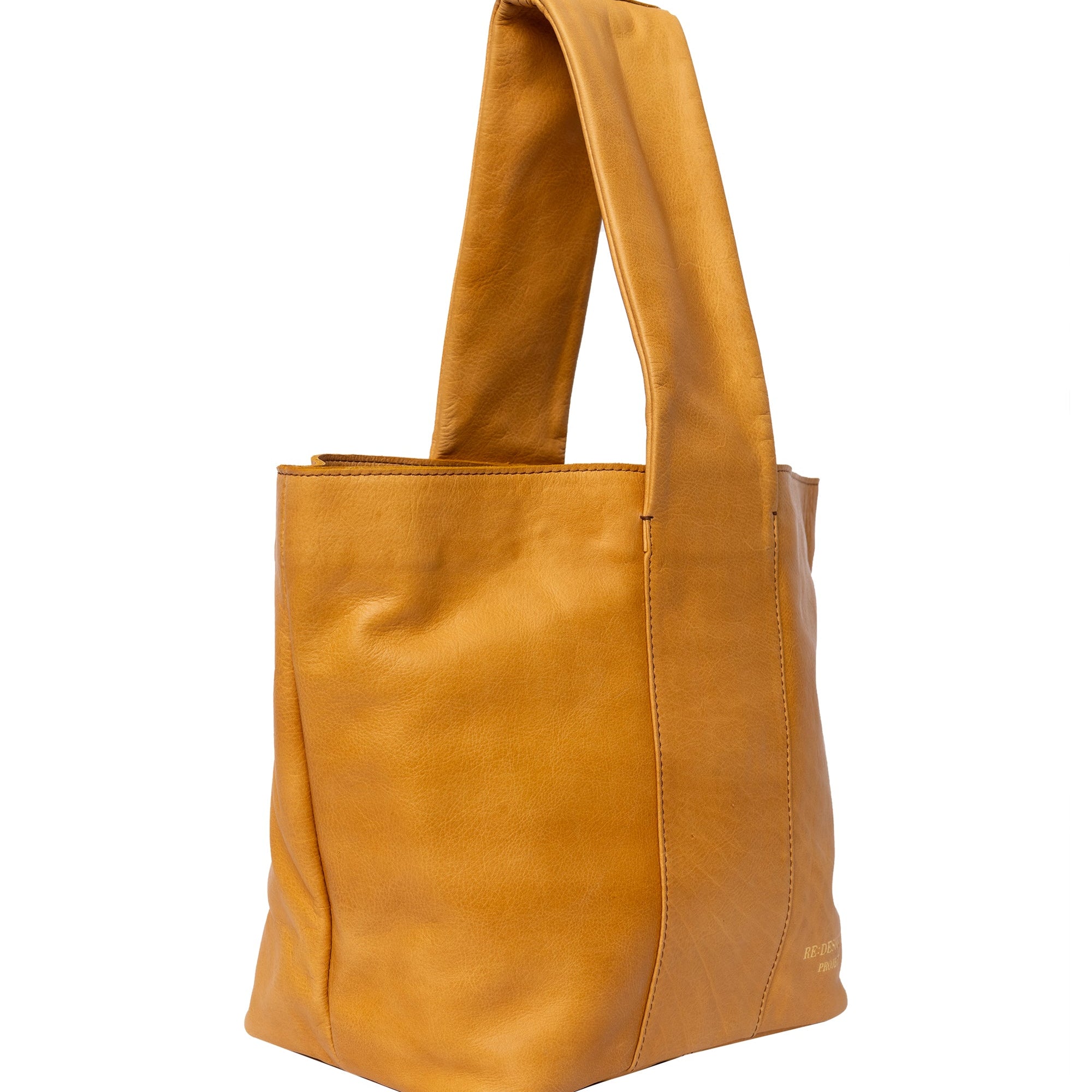 Brown leather tote bag on a white background