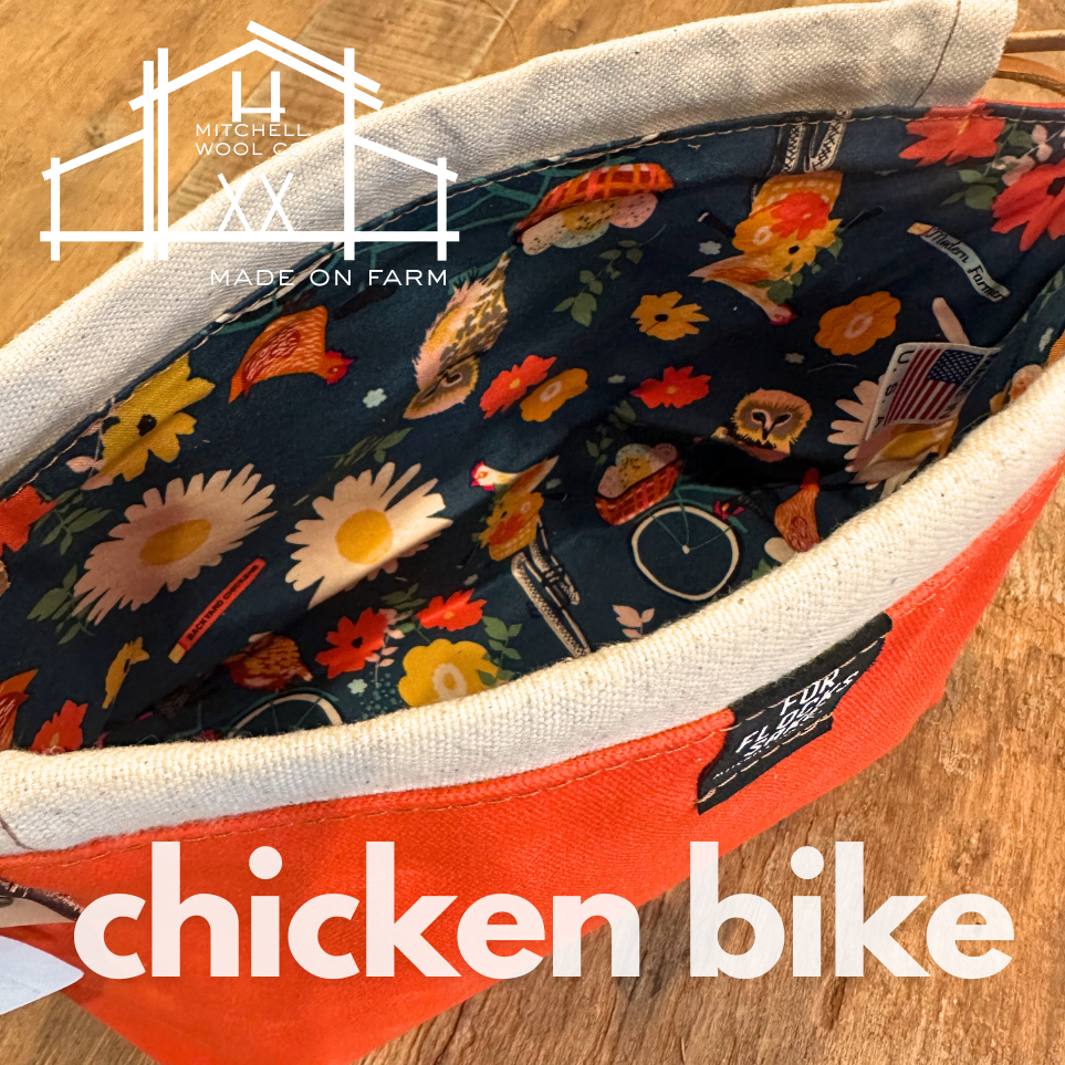 Chickens on bikes with Floral-patterned fabric with 'Mitchell Wool' branding and 'Made on Farm' text, featuring a 'chicken bike' design.