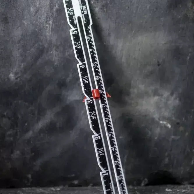 Ruler with measurement markings on a dark textured background