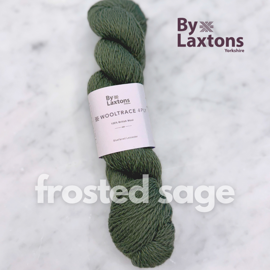 dark sage Green skein of yarn with a By Laxtons label on a light gray background